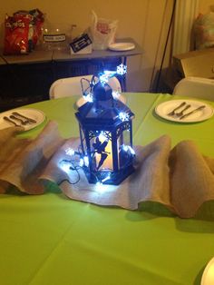 a table with plates, forks and utensils sitting on top of the table