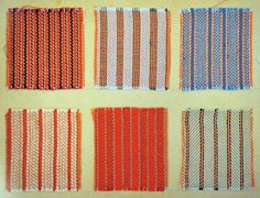 four rows of orange, blue and white woven fabric on a tablecloth with stitching