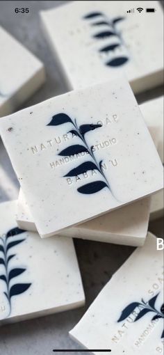 four soap bars with black leaves on them