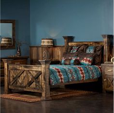 a bedroom with blue walls and wooden furniture