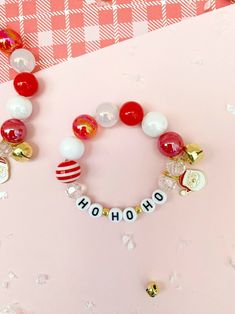 Jingle All the Way with Our Ho Ho Ho Charm Bracelet! Celebrate the season with a touch of charm and festivity! This bracelet also makes the perfect gift or stocking stuffer! It's all in the details 6.5" Bracelet made with 8mm and 12mm acrylic beads, one charm and a little gold jingle bell, strung on stretch cord Christmas Jewelry Diy, Boutique Ideas, Bracelet Accessories, Christmas Bracelet, Bracelet Diy, Jingle All The Way, Christmas Charms, Jingle Bell, Ho Ho Ho