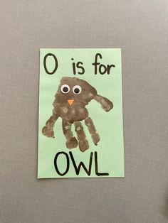 an owl handprint on a piece of paper with the words o is for owl