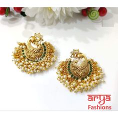 Saba Amrapali Inspired Golden Polki Chandbali Earrings Premium Quality Polki Chandbali Earrings Length: Approx. 2" Light-weight Push-Back closure Gold Finish on high-quality brass as the base metal, Kundan stones and Pearls Suitable for any traditional for contemporary attire and occasion In-stock & ready-to-ship **Color may vary slightly due to photography and lighting. Elegant Peacock Design Chandbalis For Festivals, Ceremonial Peacock Chandbalis For Festivals, Elegant Peacock Design Earrings For Puja, Chandbali Peacock Earrings For Puja, Peacock Design Chandbali Earrings For Puja, Navratri Celebration Earrings With Peacock Design, Navratri Celebration Peacock Design Earrings, Ceremonial Chandbali Earrings With Peacock Design, Ceremonial Peacock Chandbali Earrings