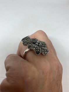 Vintage ring surrounded by Swiss cut fine Marcasite Sterling silver Size 6 can be sized by my jeweler. His service charge is $10-$20 All rings are shipped in a nice gift box. Check out our over a THOUSAND great reviews Engraving is $4 per letter and is not always perfect depending on the piece. It can take a few days if the jeweler is busy. This is payable to Paypal Judithsltd@gmail.com Vintage Silver Flower Ring Gift, Vintage Silver Flower Ring For Gift, Silver Vintage Flower Ring For Gift, Vintage Sterling Silver Flower Ring Gift, Silver Flower Ring Stamped 925 As Gift, Marcasite Rings Stamped 925 As A Gift, Marcasite Sterling Silver Rings For Gifts, Stamped 925 Marcasite Rings For Gifts, Gift Rings Stamped 925 With Marcasite