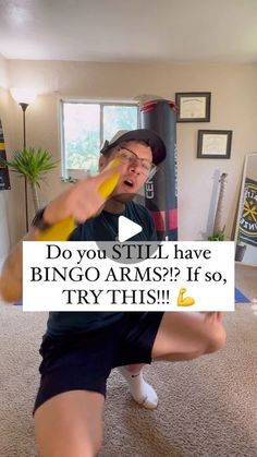 a man is playing with a frisbee on the floor in his living room