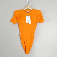 New! Zara New Bodysuit Size Medium | Ruffle Sleeves | Super Comfortable And Stretchy | Bright Orange | 95% Cotton | 5% Elastane Flat Measurements 13” Wide 27” Long 12” Leg Opening Casual Short Sleeve Ruffled Bodysuit, Spring Casual Bodysuit With Ruffles, Spring Short Sleeve Bodysuit With Ruffles, Spring Bodysuit With Ruffles And Short Sleeves, Casual Stretch Bodysuit With Ruffles, Spring Short Sleeve Ruffled Bodysuit, Summer Short Sleeve Bodysuit For Workwear, Fitted Short Sleeve Bodysuit With Ruffles, Fitted Ruffle Bodysuit With Short Sleeves