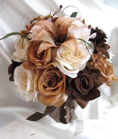 the bridal bouquet is made up of brown and white flowers