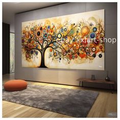 a large painting hanging on the wall in a living room