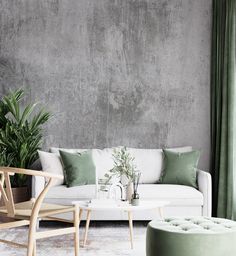 a living room filled with furniture and green curtains on the window sill next to a white couch