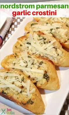 four pieces of garlic bread on a white plate