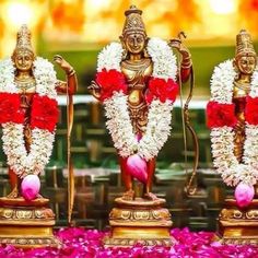 three statues with flowers on them and the words sri ramavanii written in english