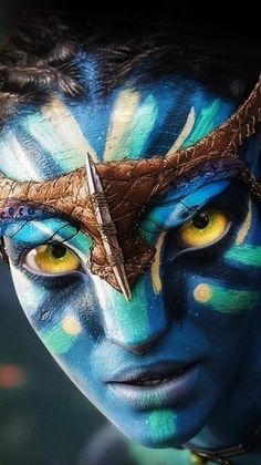 a close up of a person with blue and yellow makeup