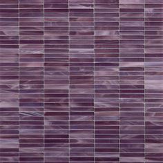 a close up view of a purple tile wall