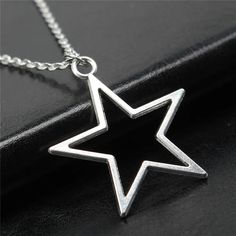 Beautifully crafted with vintage appeal, this Geometric Silver Color Hollow Star Necklace is stunningly crafted with Zinc alloy! Capture lasting style with this must-have accessory. DETAILSMaterial: MetalMetals Type: Zinc alloyStyle: VintageShape\pattern: Geometric Silver Star-shaped Metal Necklace, Metal Star Charm Jewelry, Star Shaped Metal Jewelry With Star Charm, Silver Star-shaped Alloy Jewelry, Vintage Nickel-free Star Jewelry, Vintage Star-shaped Nickel-free Jewelry, Vintage Silver Jewelry With Star Charm, Vintage Star-shaped Metal Jewelry, Adjustable Vintage Star-shaped Jewelry