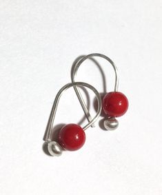 Petite and sweet blush berry red Coral gemstone earrings...modern design, minimal in mind... = details =  6mm red Coral suspend from... 3mm fine silver budded ear wires.  approx. 3/4"  long finish options: bright silver or lightly oxidized patina  Note: To put on, gently pull wires side ways in opposite directions and slide through ear hole in order to keep their shape. Each handmade ArtAffections Jewelry piece is presented to you hanging on a card within a plastic sleeve and ready wrap up as a gift. BEAD STONE EARRINGS GALLERY: https://www.etsy.com/shop/ArtAffectionsJewelry?ref=seller-platform-mcnav&search_query=BEAD+EARRINGS RETURN TO SHOP : ArtAffectionsJewelry.etsy.com FEEDBACK: "One of Etsy's best! This seller is phenomenal...worked with me on a special order & was very accommodating Minimalist Red Round Earrings, Red Sterling Silver Earrings For Everyday, Dainty Red Earrings For Everyday, Nickel-free Red Earrings For Everyday, Red Nickel-free Earrings For Everyday Wear, Red Hypoallergenic Earrings For Everyday Wear, Small Hoop Red Earrings For Everyday, Red Minimalist Dangle Earrings, Dainty Handmade Red Earrings