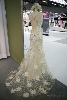 a dress with flowers on it is displayed