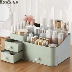 an assortment of beauty products are displayed on a wooden table in front of a mirror