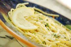 pasta with lemon and parmesan cheese on a plate