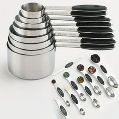 a stack of spoons and measuring cups sitting next to each other