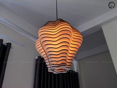 a lamp hanging from the ceiling in a room