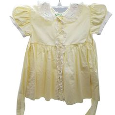 Vintage Baby Toddler Doll Dress Pale Light Yellow White Alfred Leon Button Lace Ruffle Cotton Blend 12 to 18 Months Sash Bow Features: • Vintage Alfred Leon Hand Made Baby Toddler Doll Dress • Pale Light Yellow with White Lace and Ruffled Embroidered Collar • Front Button Closure with Sweet shell like buttons Outlined with ruffles • Long sash belt into bow • Based on Measurements, 12 to 18 months (no size tag) • Fancy Vintage • Spring • Solid • Made in Phillipines • Machine Wash • Cotton Blend m Vintage Dress With Ruffle Hem And Doll Collar, Classic Vintage Dress With Ruffles For Spring, Summer Doll Collar Dress With Buttons, Retro Dress With Ruffles And Peter Pan Collar, Retro Dress With Peter Pan Collar And Ruffles, Retro Dress With Ruffles And Doll Collar, Cute Daywear Dresses With Ruffled Collar, Short Sleeve Ruffled Vintage Dress For Dress-up, Short Sleeve Vintage Dress With Ruffles For Dress-up