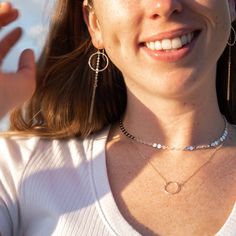 Our pieces are sure to make you smile! This simple look is two of our best-selling necklaces (Sequin Choker + Hammered Circle Necklace) with our showstopping Circle Bar Dangle Earrings for an instant mood boost. Silver Coin Necklace For Everyday, Dainty Chain Necklace For Layering, Elegant Hammered Choker Necklace, Adjustable Dainty Coin Pendant Jewelry, Minimalist Layered Necklace With Adjustable Chain, Chic Metal Lariat Jewelry, Dainty Clavicle Chain With Open Circle Pendant, Elegant Hammered Choker Jewelry, Dainty Open Circle Clavicle Chain Jewelry