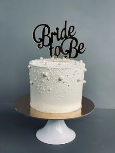 a wedding cake with the word bride to be on top