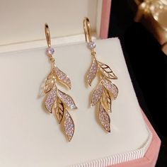 These Elegant Leaf Dangle Drop Earrings Are Perfect For Any Outfit. This Design Is Sleek And Modern Yet Classic And Elegant Style, Well Matched For Dress, Appointment, Daily, Wedding And Any Other Occation. Perfect Gift: This Earrings Will Be A Special Gift For Friends, Wife, Daughter, Mother, Sister, Perfect Gift For Christmas, Graduation, Birthday, Thanksgiving Day, Anniversary, Graduated Day, Mother's Day. Material: Alloy/Cubic Zirconia Size: 2.0"X0.4" Color: Gold Elegant Leaf-shaped Earrings For Party, Elegant Leaf-shaped Party Earrings, Fendi Earrings, Candy Corn Earrings, White Hoop Earrings, Pink Sapphire Earrings, Handmade Candy, Romantic Earrings, Birthday Thanksgiving