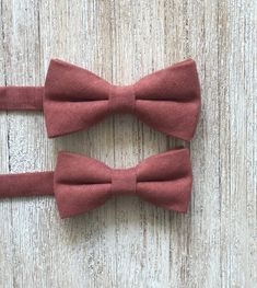 "PROCESSING TIMES ARE NOW 3-7 BUSINESS DAYS. Wedding season is here and we are working hard to make and fulfill your order! We appreciate your patience. We do have expedited options available if needed otherwise it may take up to 7 business days to get your package to the post office. Happy Weddings! : ) This desert Coral cotton bow tie & caramel brown adjustable faux leather suspender set is perfect for your groomsmen, ring bearers, family photos or just because! Suspenders come with brass Terracotta Suspenders Groomsmen, Elegant Brown Belts And Suspenders For Wedding, Brown Leather Belts And Suspenders As Gifts, Adjustable Brown Bow Tie In Dapper Style, Father's Day Brown Formal Bow Tie, Classic Brown Bow Tie For Groom, Terracotta Bow Tie And Suspenders, Groomsmen Ring, Adjustable Brown Belts And Suspenders With Bow