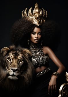 a woman with an afro standing next to a lion in front of a black background