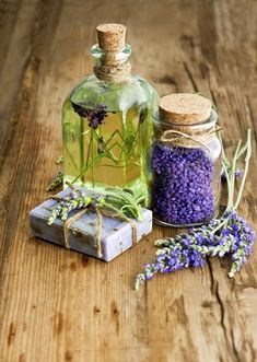 lavender massage oil and soap on wooden table with text overlay that says lavender massage oil