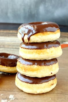 chocolate covered donuts stacked on top of each other