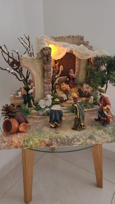 a nativity scene is displayed on a table