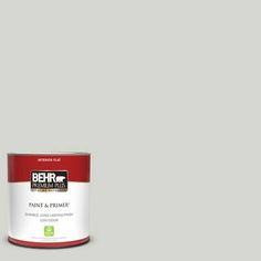 behr paint and primer is shown in the color light brown, with a white base