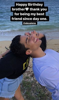 a man is kissing his friend on the beach