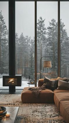 a living room filled with furniture and a fire place in the middle of a forest