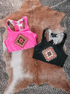 These reversible sports bras/tops are so cute! A simple design on one side and cowprint on the other! No padding, true to sports bra sizing These could also be worn for a swim top too! Cowgirl Clothing, Cute Cheap Cow Print Tops, Cute Western Bathing Suits, Western Clothing, Western Stuff, Western Clothes, Cute Western Bikinis, Western Sport Bra, Cute Southern Outfits