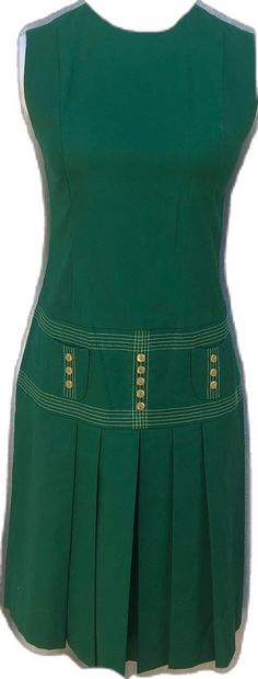 Green Knee-length Mini Dress With Pockets, Green Cotton Lined Mini Dress, Sleeveless Cotton Dress With Pleated Hem, Green Pleated Knee-length Mini Dress, Green A-line Dress With Pleated Skirt, Classic Green Cotton Dress, Green Casual Dress With Pleated Skirt, Casual Green Dresses With Pleated Skirt, Green Fitted Dresses With Pleated Skirt