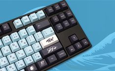 a computer keyboard sitting on top of a blue and white background with an image of a dragon