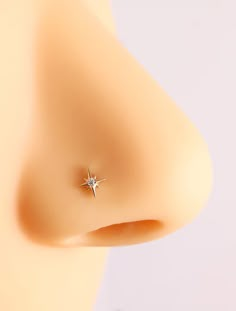 a close up view of a nose with a small star on it's side