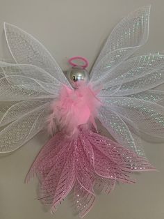 pink and white fairy wings hanging from the ceiling