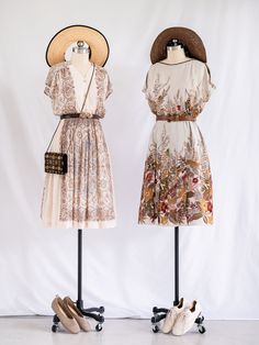 Transport yourself to a bygone era with our Sugar Cream Vintage beige chiffon midi dress. Adorned with a charming paisley print, this unique piece features a V neck with front buttons and short sleeves, evoking nostalgic elegance.   The elasticated waist and pleated skirt ensure a perfect fit and timeless silhouette, while embodying sustainable fashion with an ethical touch. Care: Cool machine wash. Dry at a lower heat and press with a medium iron.  Condition: Embrace the distinctive charm of this upcycled treasure, where imperfections are unique features. Delight in the occasional loose thread or subtle discoloration, each adding to the character and history of this special garment. Beige Vintage V-neck Dress, Vintage Chiffon Midi Dress, Flowy Vintage Chiffon Dress, Vintage Chiffon Day Dresses, Vintage Flowy Midi Dress For Daywear, Flowy Vintage Midi Dress For Daywear, Vintage Flowy Knee-length Midi Dress, Vintage Knee-length Flowy Midi Dress, Flowy Vintage Knee-length Midi Dress