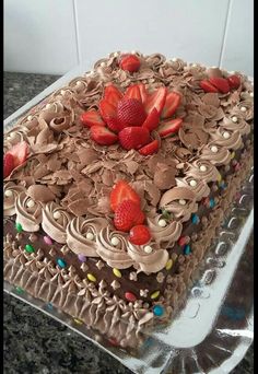 a cake with chocolate frosting and strawberries on top