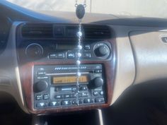 an old radio in the dashboard of a car, with no one around it or someone else