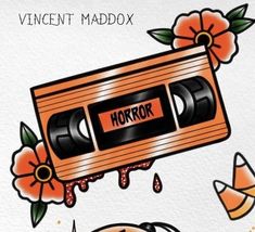 an orange and black tape recorder with the word horror on it, surrounded by flowers