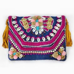 The bohemian design features intricate embroidery and delicate beading with a trim of tassels. This bag is decorated with shells and beads perfect for any occasion. It is also called banjara bags, wear it with a casual or formal dress this bag looks elegant and classy with any outfit you wear. It comes with a leather belt that looks great with this banjara bag. It comes with a cotton lining inside the bag with one zipper pouch. You can put your daily essentials like mobile, keys, notebook, etc. Bohemian Straw Bag With Tassels For Daily Use, Bohemian Clutch Bag For Daily Use, Bohemian Clutch Shoulder Bag For Travel, Bohemian Style Clutch Shoulder Bag For Travel, Bohemian Rectangular Clutch For Summer, Bohemian Beaded Bag For Everyday Use, Bohemian Multicolor Shoulder Bag For The Beach, Bohemian Beaded Shoulder Bag For Vacation, Bohemian Clutch Shoulder Bag For Festivals