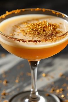 a drink with gold sprinkles on the rim