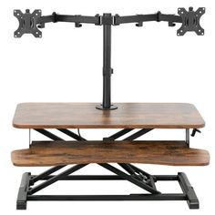 a wooden table with two black metal brackets on the top and one shelf underneath it