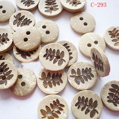 wooden buttons with flowers and leaves on them