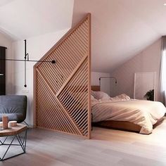 a bedroom with an open door leading to the bed and sitting area in front of it